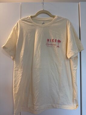 Nike Pastel Yellow/Cream Tee with Pink Palm Sportswear Print